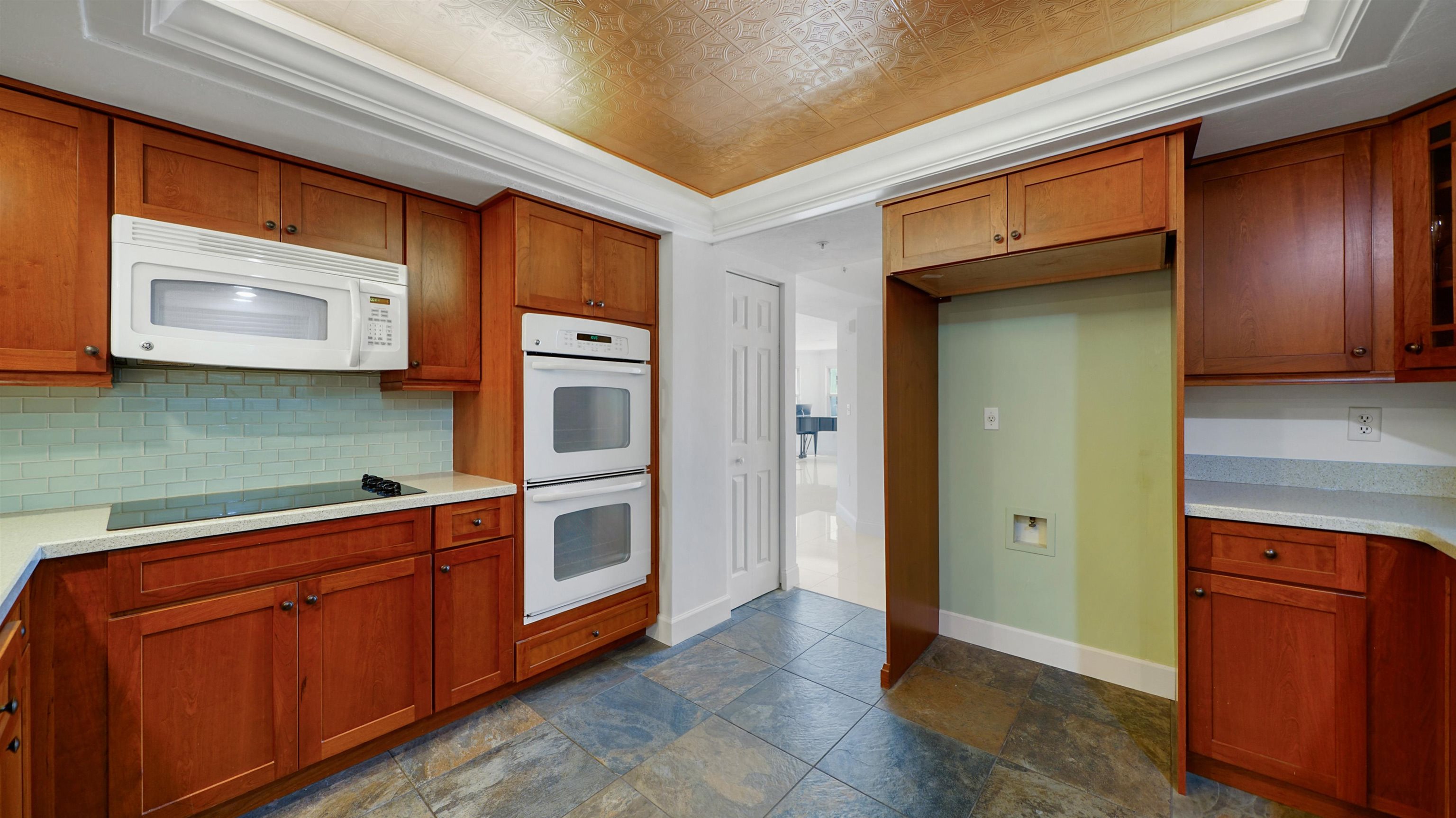 1 John Anderson Drive, Unit 218 Ormond Beach, FL 32176 - Photo 14 of 69 a kitchen with stainless steel appliances granite countertop a refrigerator and a microwave
