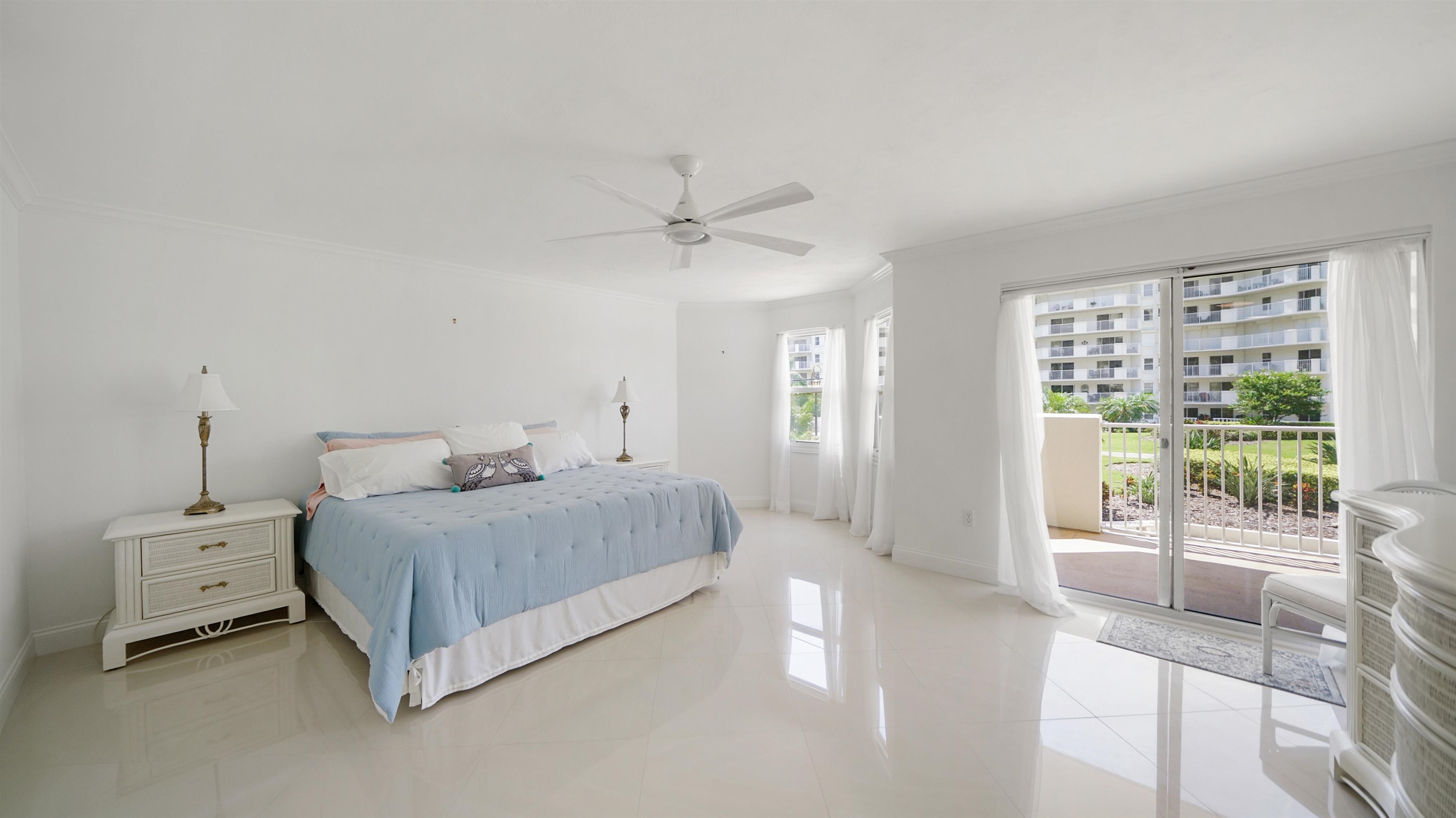 1 John Anderson Drive, Unit 218 Ormond Beach, FL 32176 - Photo 18 of 69 a bedroom with a bed and a large window with outer view