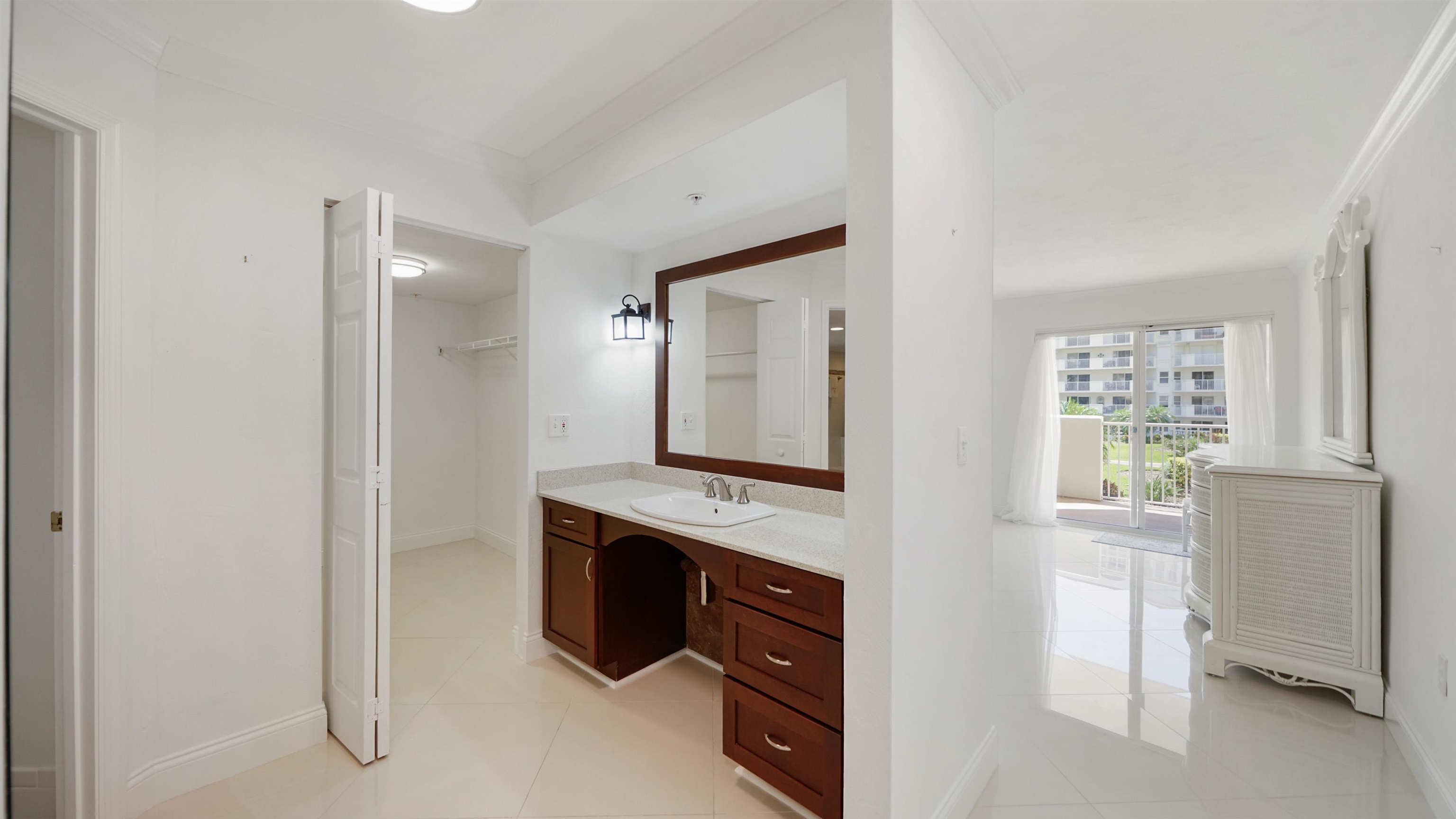 1 John Anderson Drive, Unit 218 Ormond Beach, FL 32176 - Photo 20 of 69 a view of cabinets with flat screen tv