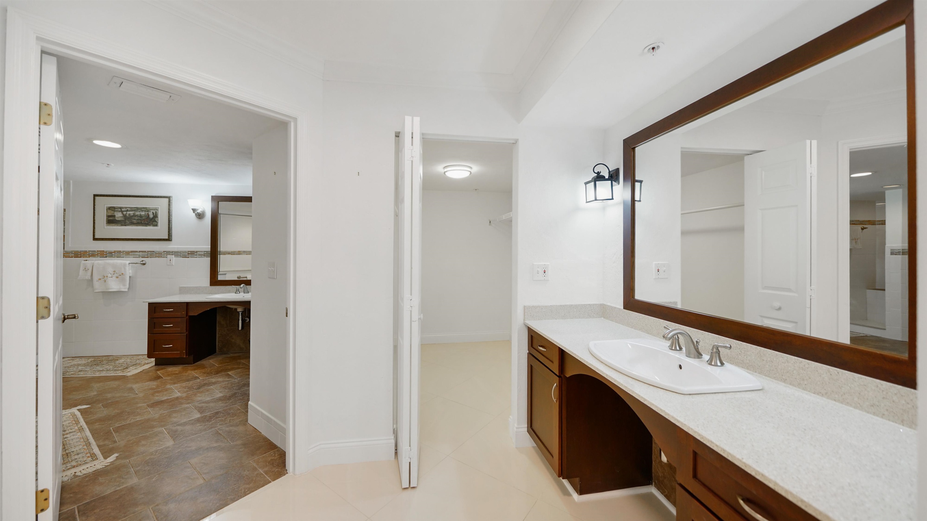 1 John Anderson Drive, Unit 218 Ormond Beach, FL 32176 - Photo 21 of 69 a bathroom with a sink double vanity and a mirror