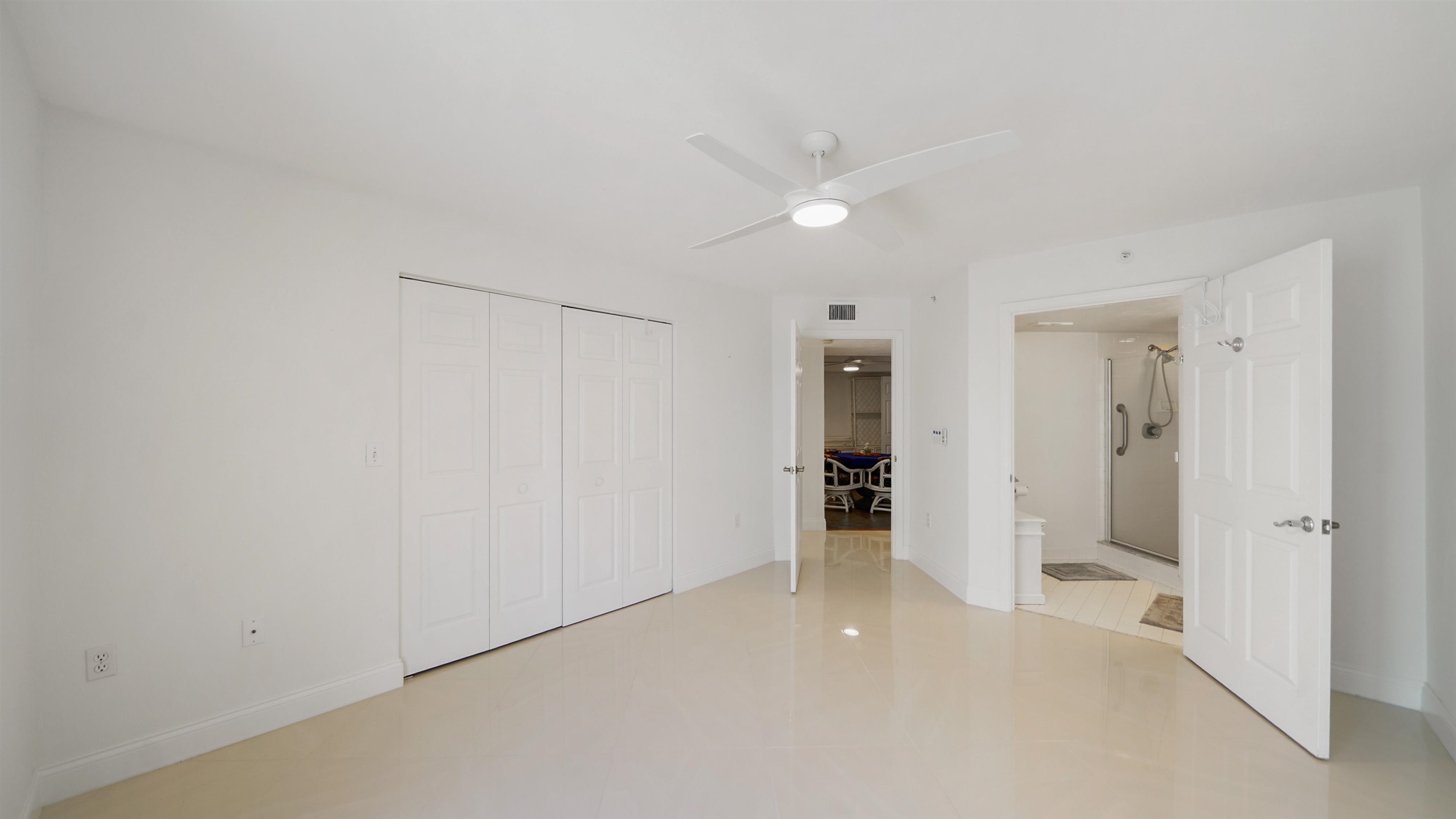 1 John Anderson Drive, Unit 218 Ormond Beach, FL 32176 - Photo 25 of 69 an empty room with closet and a bathroom