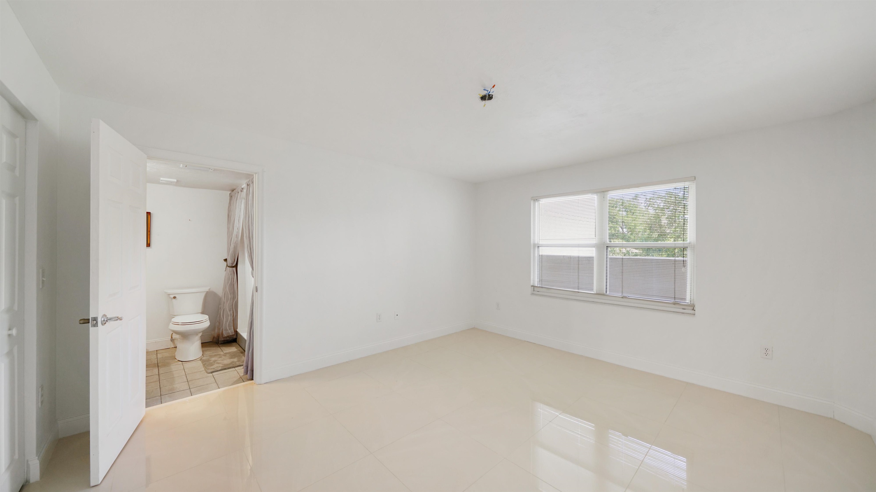 1 John Anderson Drive, Unit 218 Ormond Beach, FL 32176 - Photo 28 of 69 a bedroom with a bed and a window