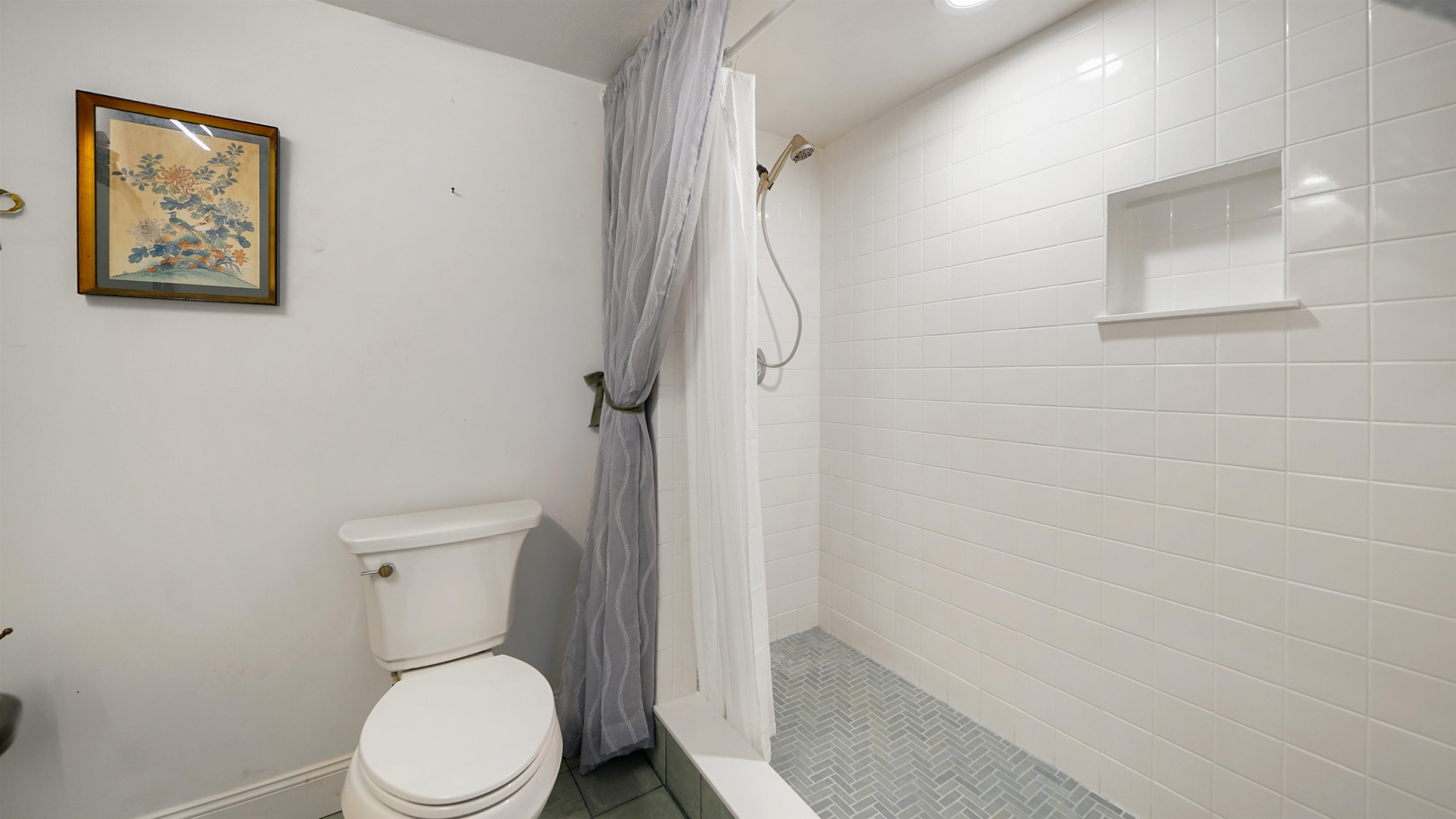 1 John Anderson Drive, Unit 218 Ormond Beach, FL 32176 - Photo 31 of 69 a white toilet sitting next to a shower