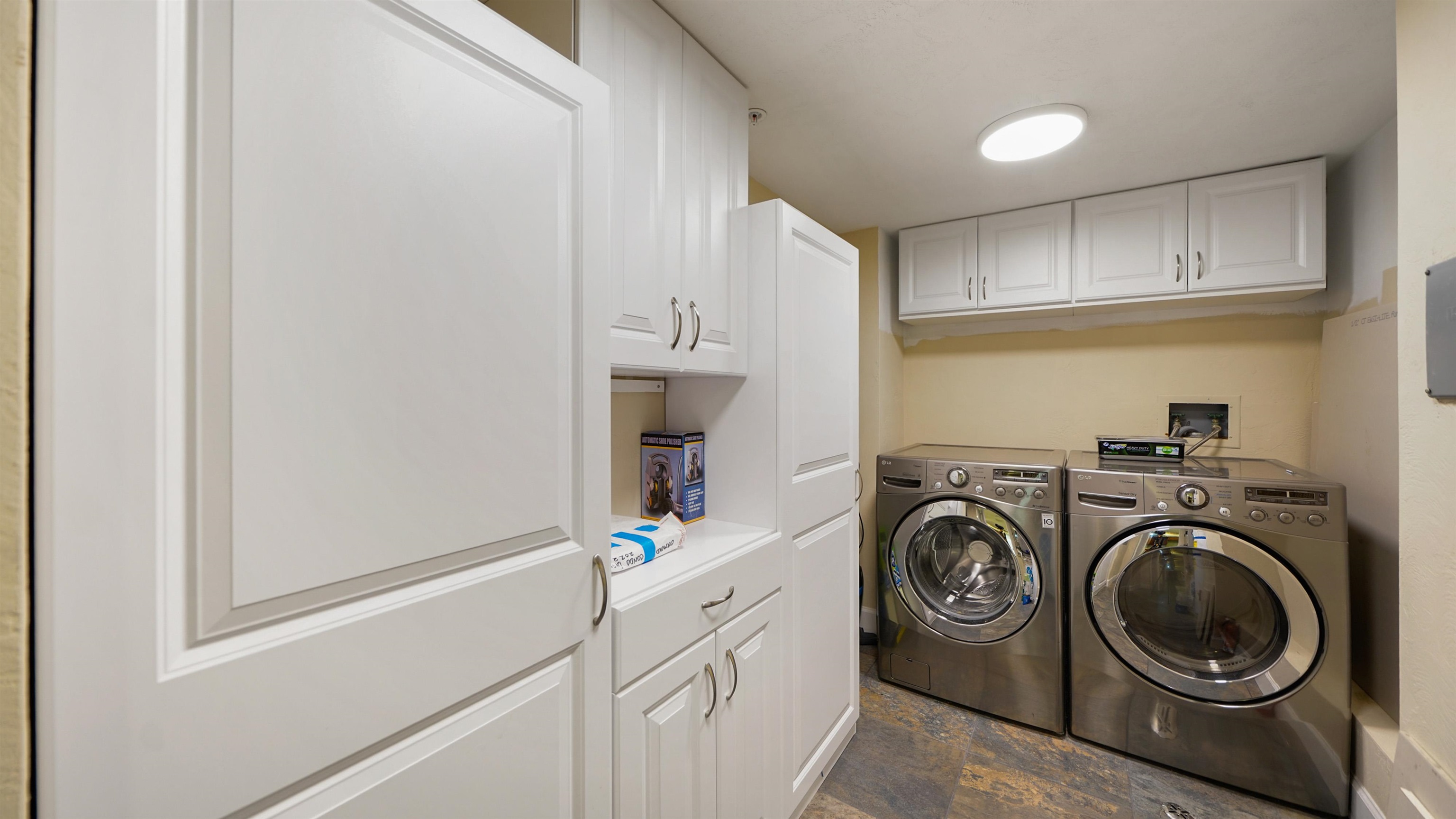 1 John Anderson Drive, Unit 218 Ormond Beach, FL 32176 - Photo 37 of 69 a utility room with sink dryer and washer