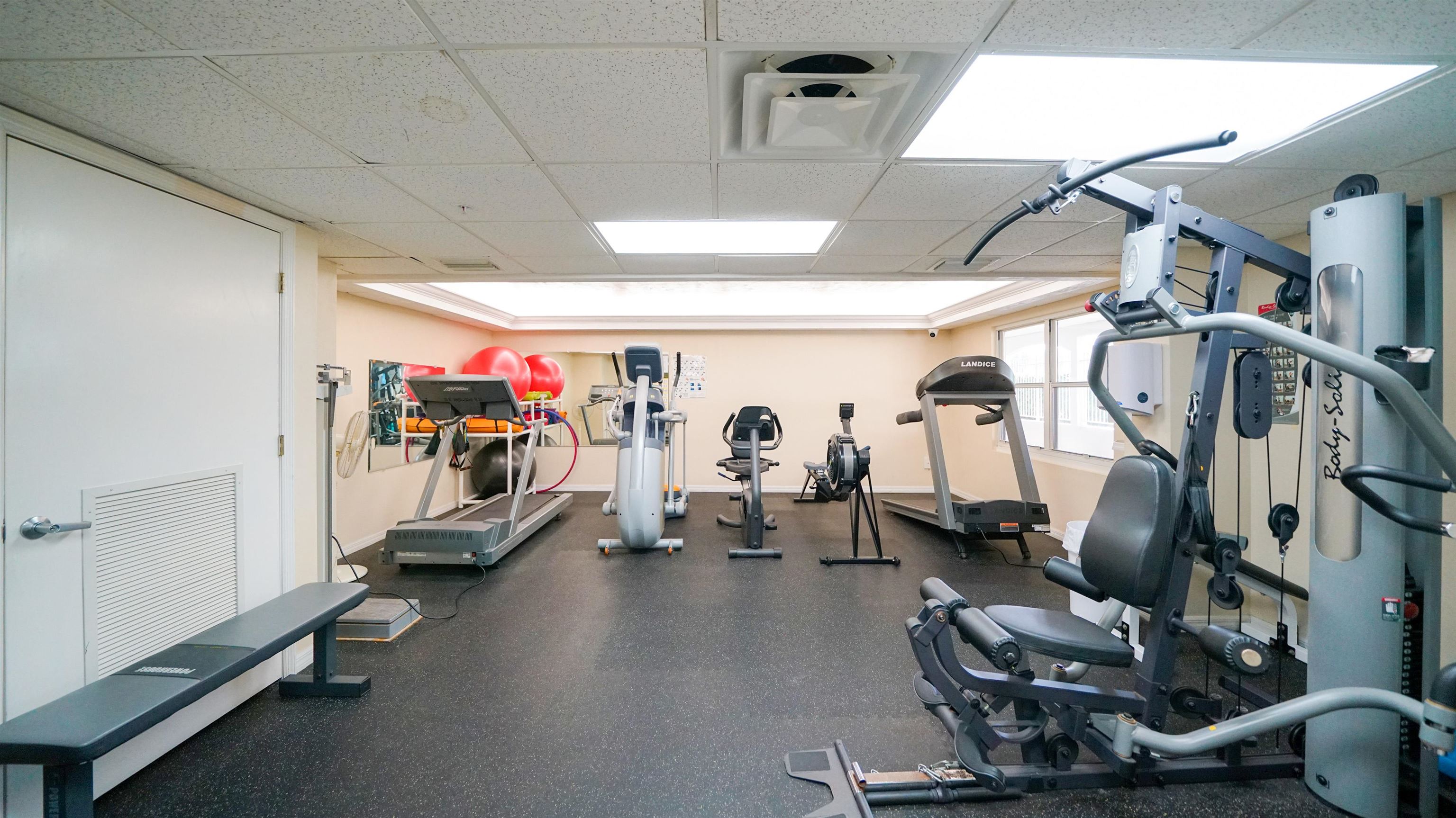 1 John Anderson Drive, Unit 218 Ormond Beach, FL 32176 - Photo 49 of 69 a view of a room with gym equipment