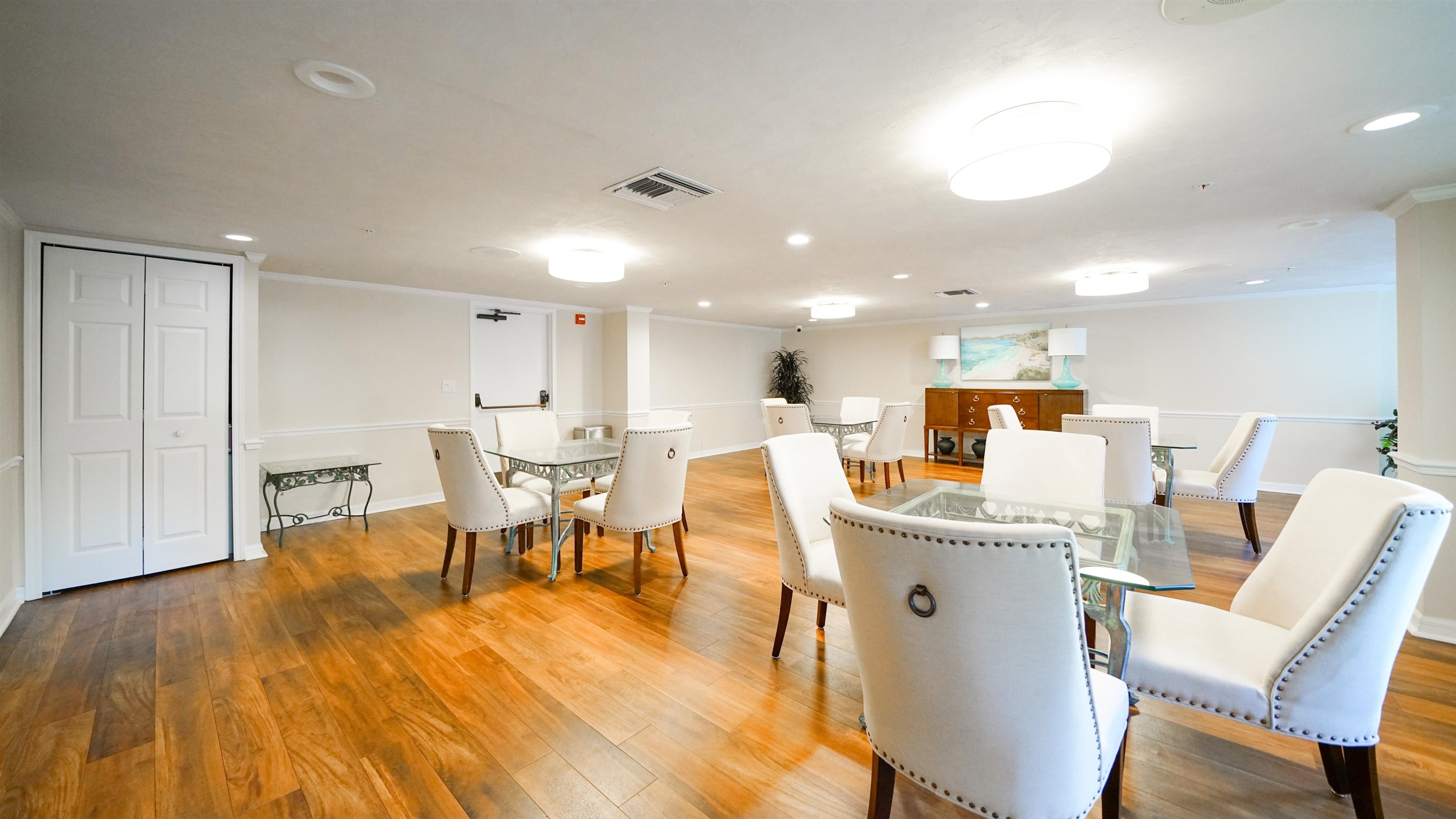 1 John Anderson Drive, Unit 218 Ormond Beach, FL 32176 - Photo 57 of 69 a view of a dining room with furniture and wooden floor