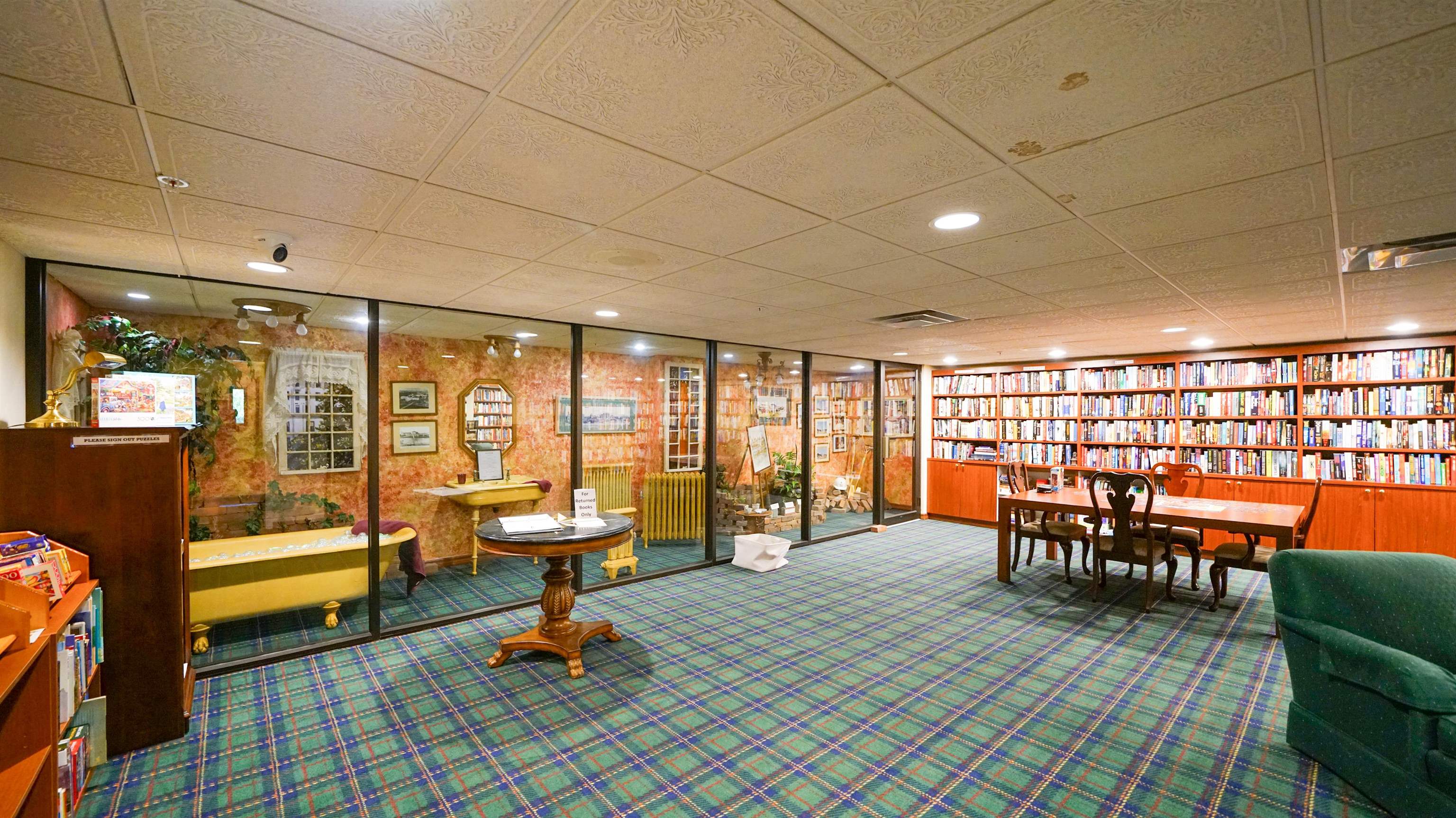 1 John Anderson Drive, Unit 218 Ormond Beach, FL 32176 - Photo 61 of 69 a living room with furniture a rug and floor to ceiling window