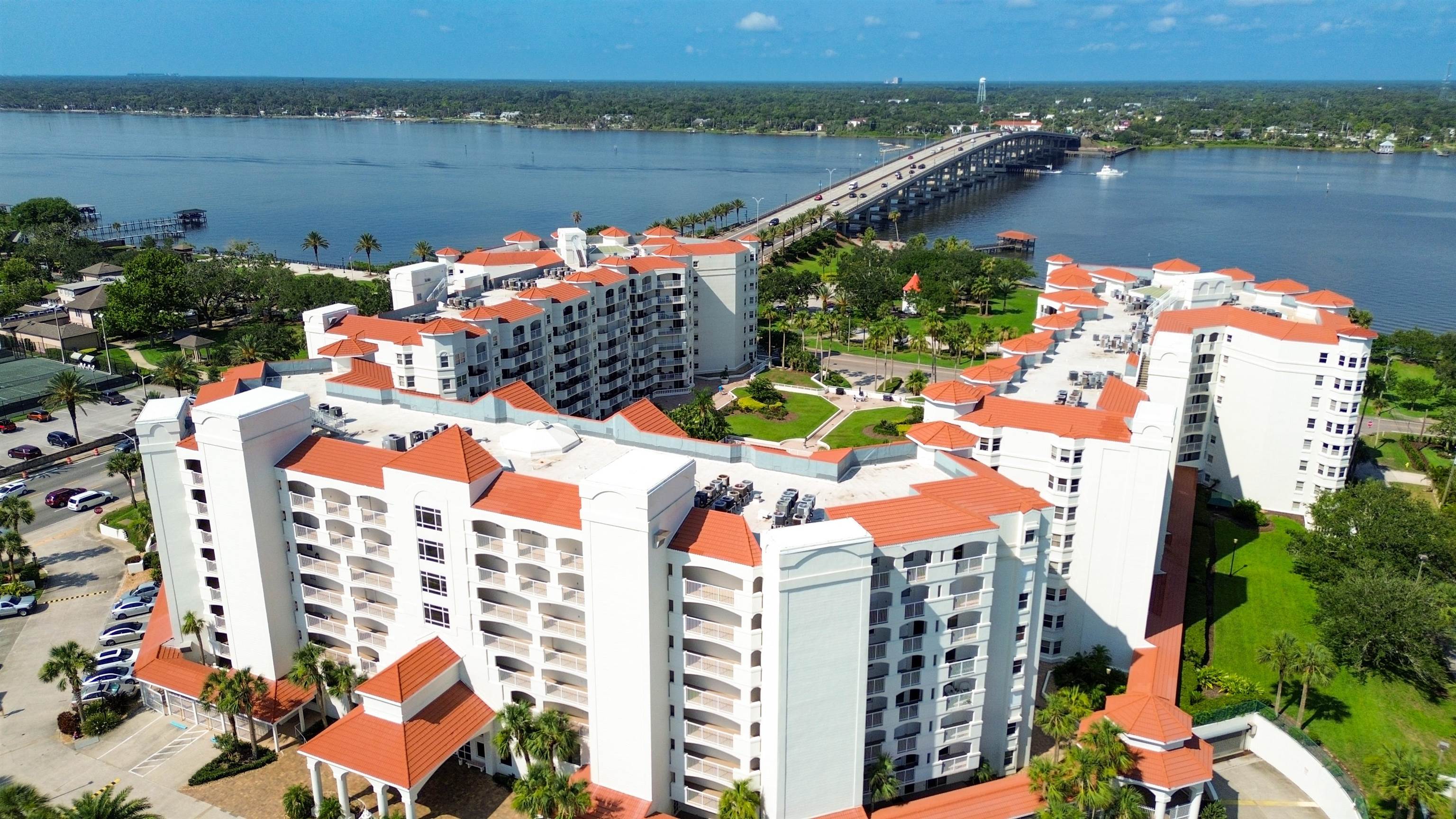 1 John Anderson Drive, Unit 218 Ormond Beach, FL 32176 - Photo 66 of 69 an aerial view of lake and residential houses with outdoor space