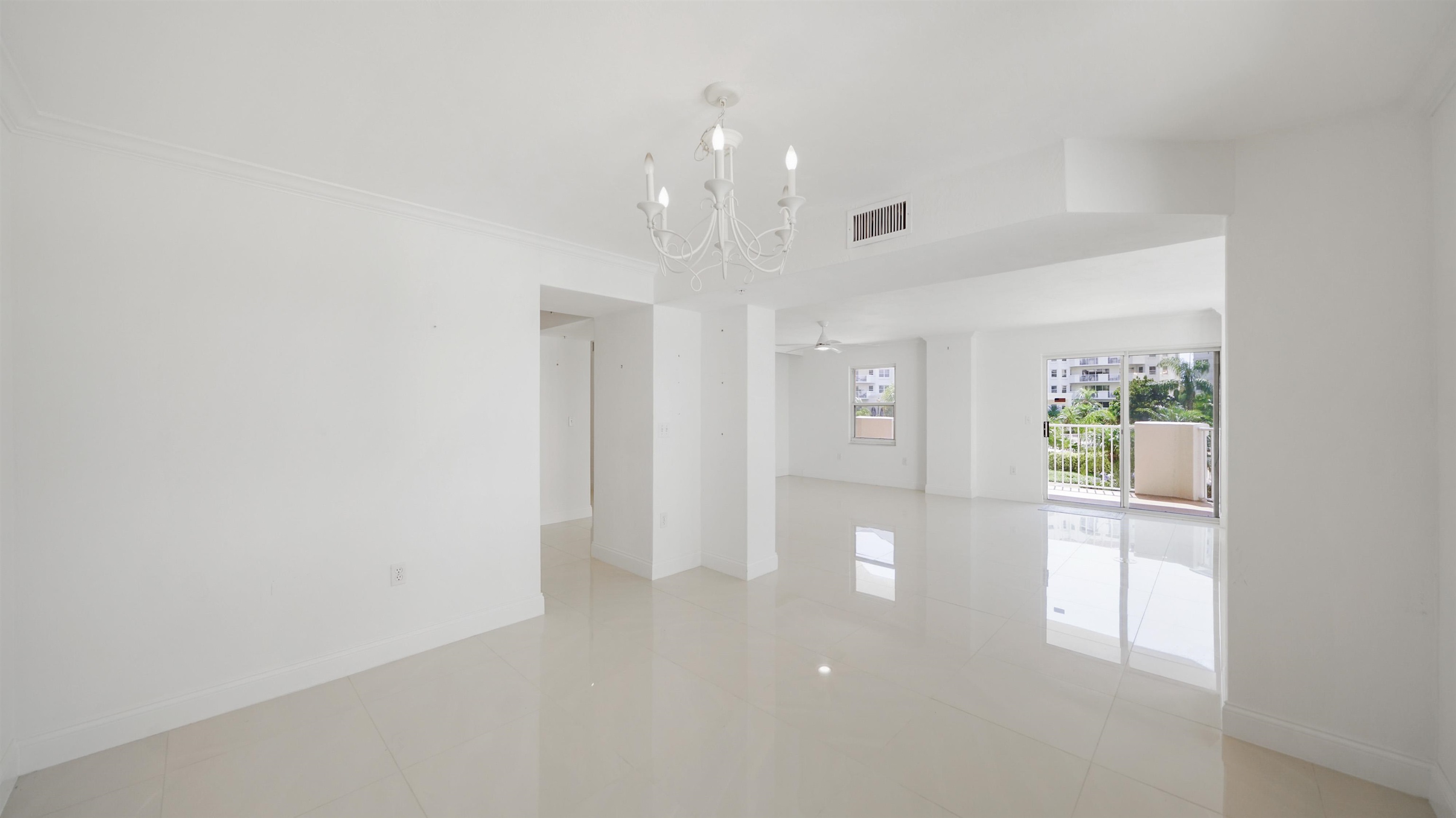 1 John Anderson Drive, Unit 218 Ormond Beach, FL 32176 - Photo 9 of 69 wooden floor in an empty room with a window