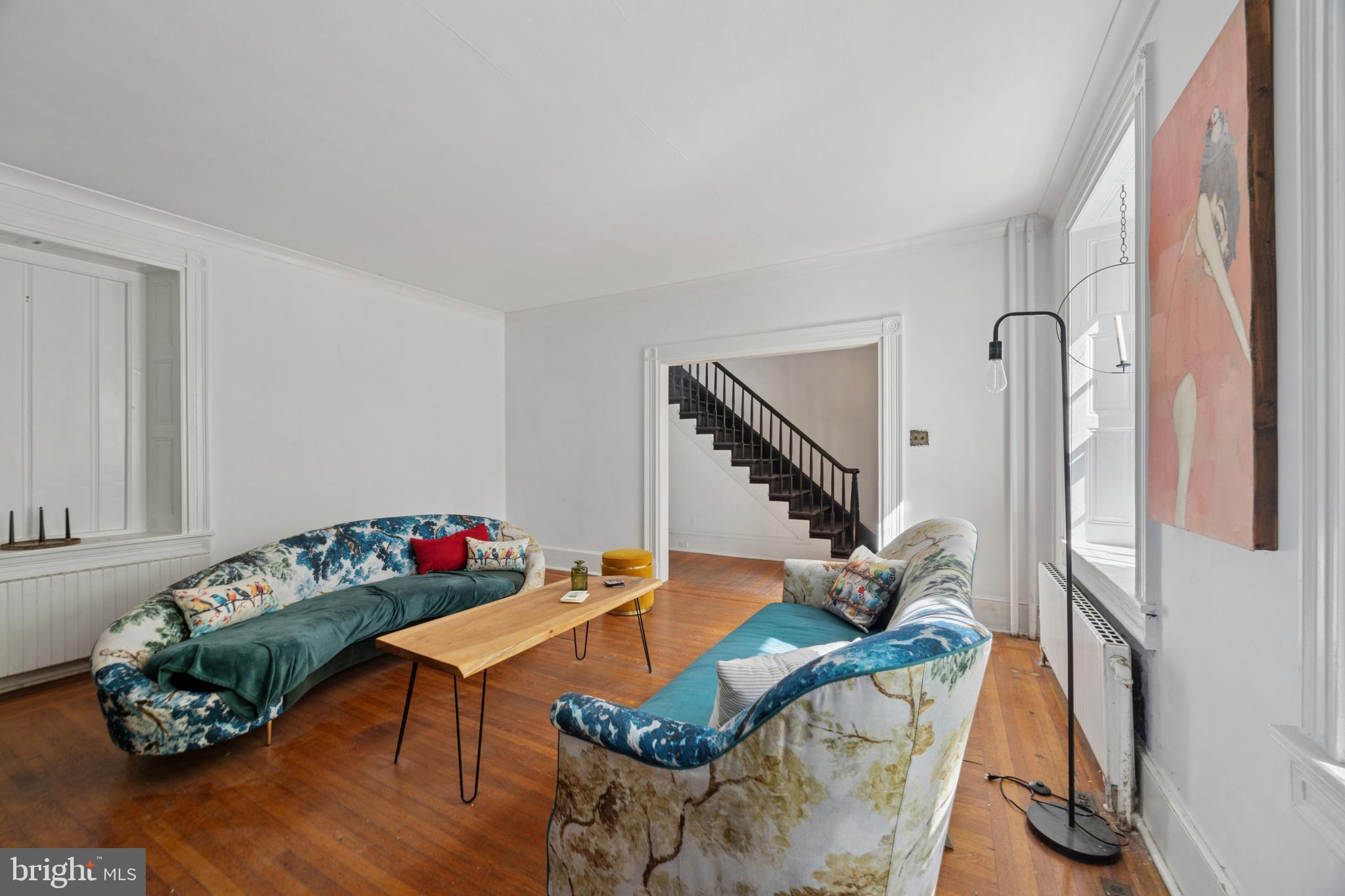 212 West 24th Street Chester, PA 19013 - Photo 5 of 30 a living room with furniture and wooden floor