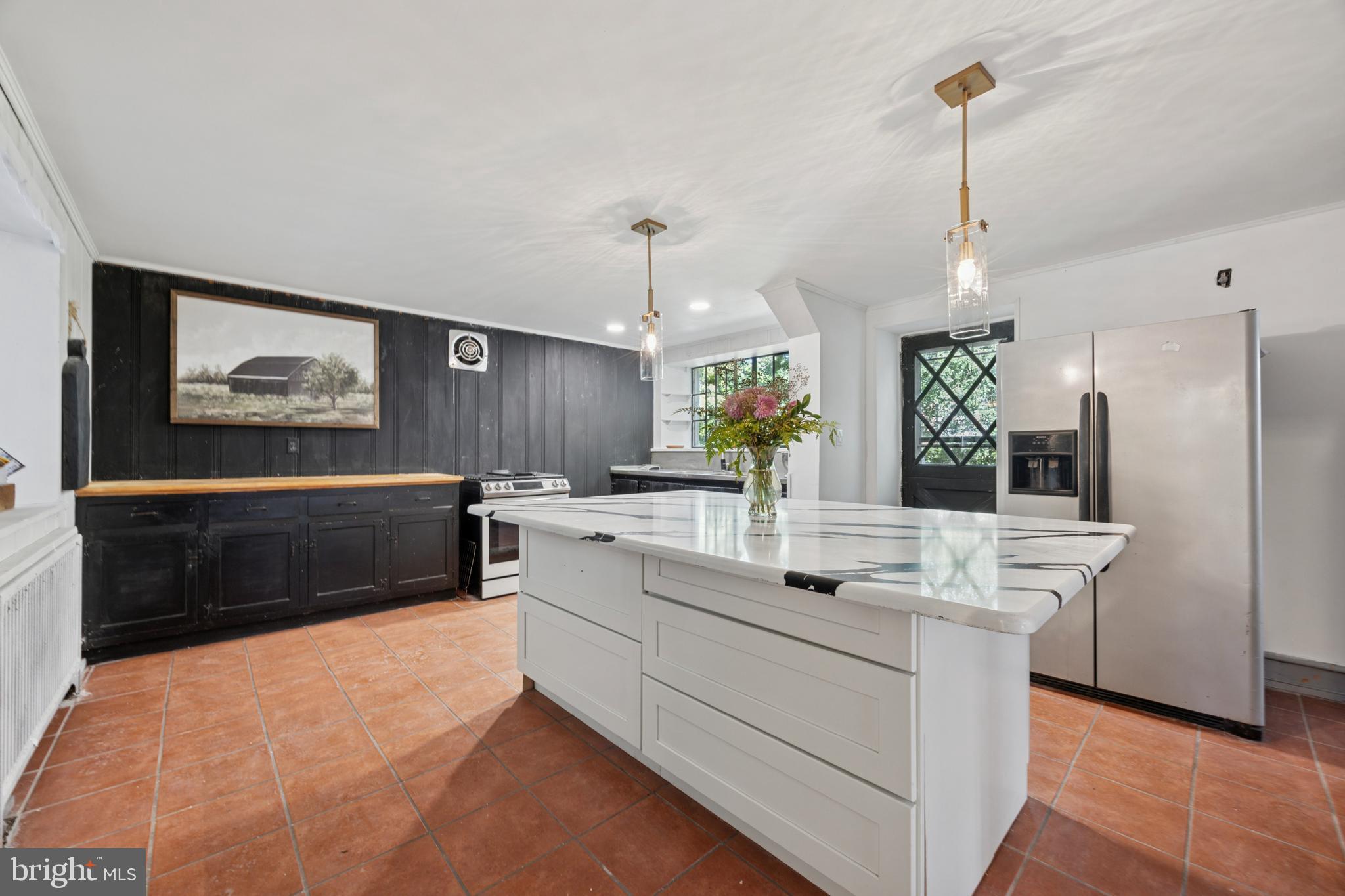 212 West 24th Street Chester, PA 19013 - Photo 10 of 30 a kitchen with stainless steel appliances a sink stove and refrigerator