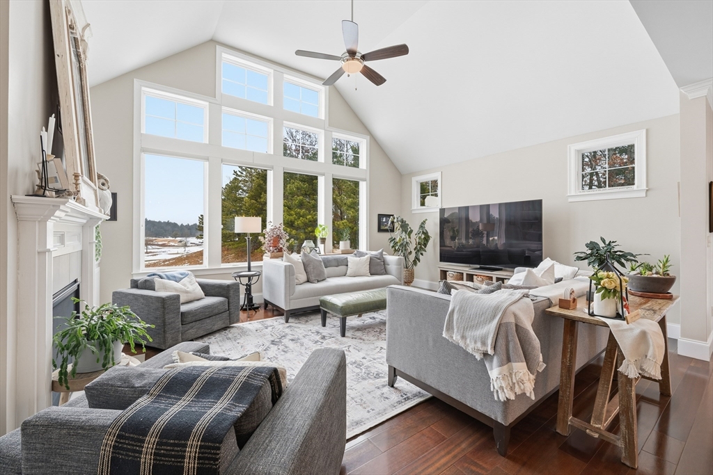 187 Rhode Island Road Lakeville, MA 02347 - Photo 11 of 42 a living room with furniture a flat screen tv and a large window
