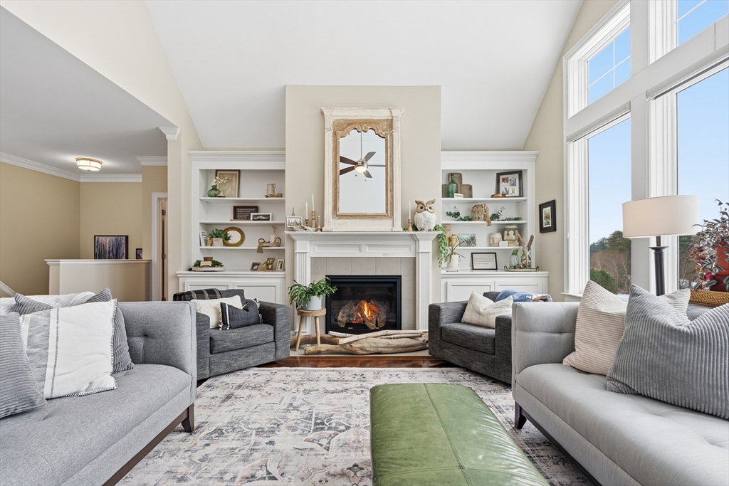 187 Rhode Island Road Lakeville, MA 02347 - Photo 13 of 42 a living room with furniture and a fireplace