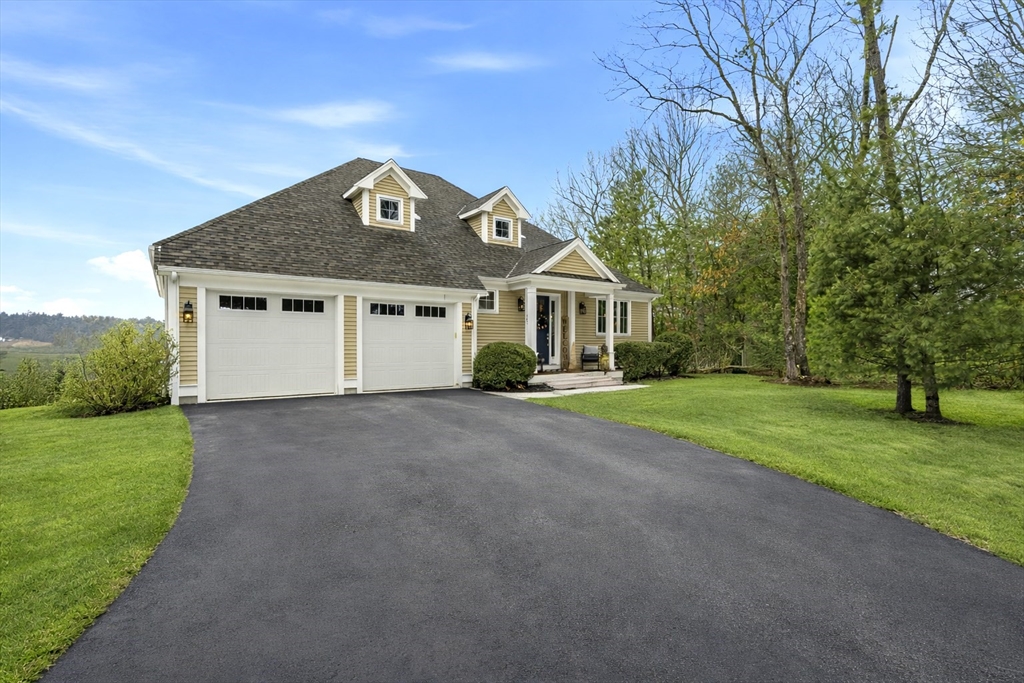 187 Rhode Island Road Lakeville, MA 02347 - Photo 2 of 42 a front view of a house with a yard