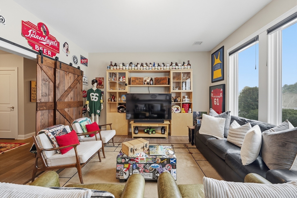 187 Rhode Island Road Lakeville, MA 02347 - Photo 29 of 42 a living room with furniture fireplace and flat screen tv