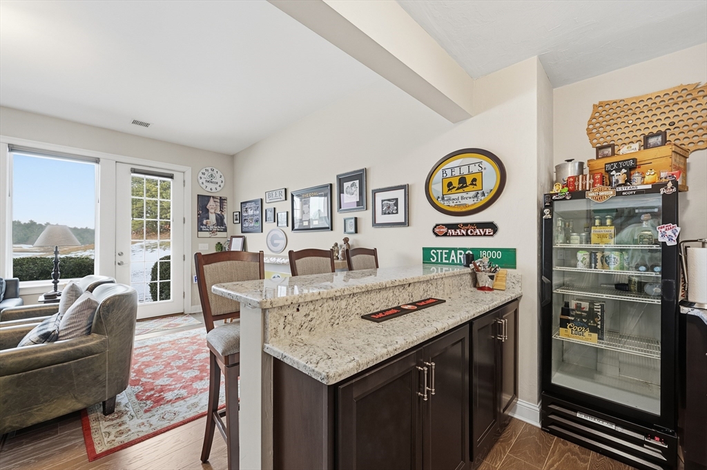 187 Rhode Island Road Lakeville, MA 02347 - Photo 33 of 42 a view of a kitchen with a table and chairs