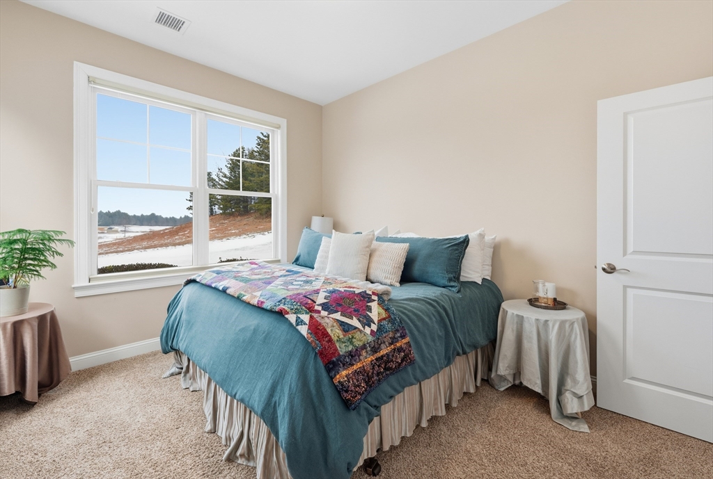 187 Rhode Island Road Lakeville, MA 02347 - Photo 34 of 42 a bedroom with a bed and window