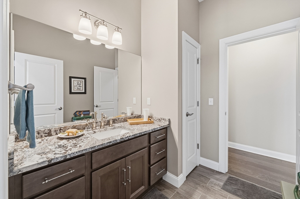 187 Rhode Island Road Lakeville, MA 02347 - Photo 35 of 42 a bathroom with a granite countertop double vanity sink and a mirror