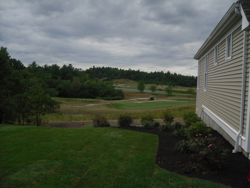 187 Rhode Island Road Lakeville, MA 02347 - Photo 42 of 42 a view of a lake with a garden