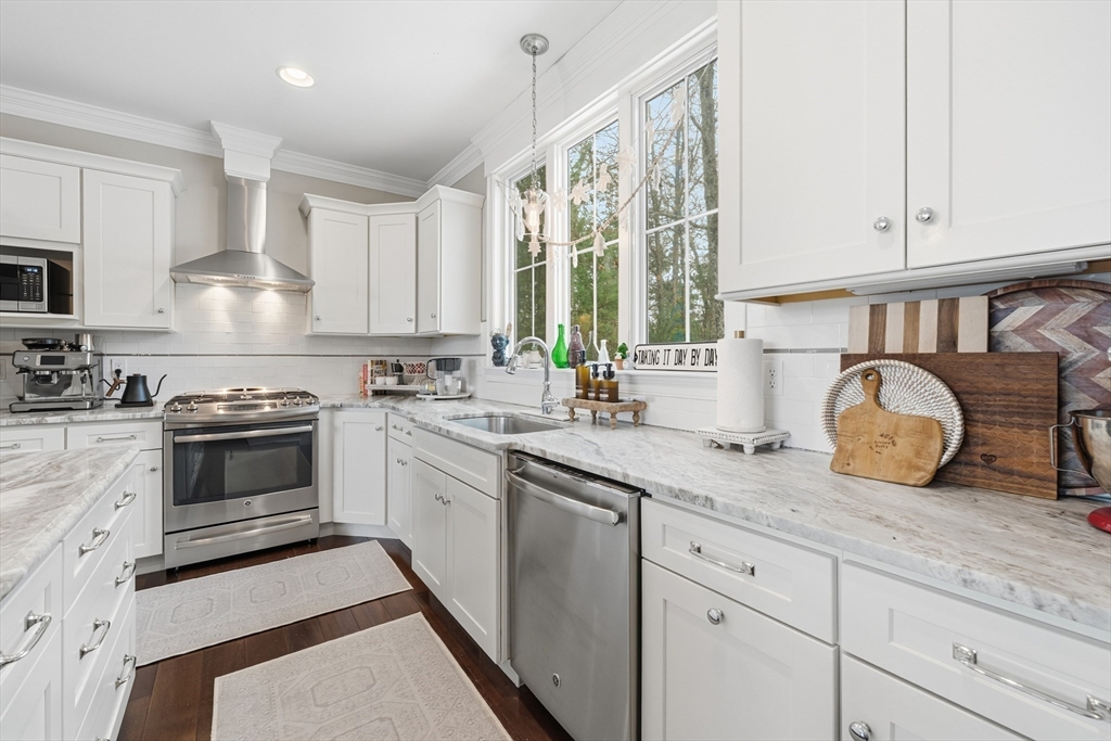 187 Rhode Island Road Lakeville, MA 02347 - Photo 9 of 42 a kitchen with granite countertop white cabinets and white appliances