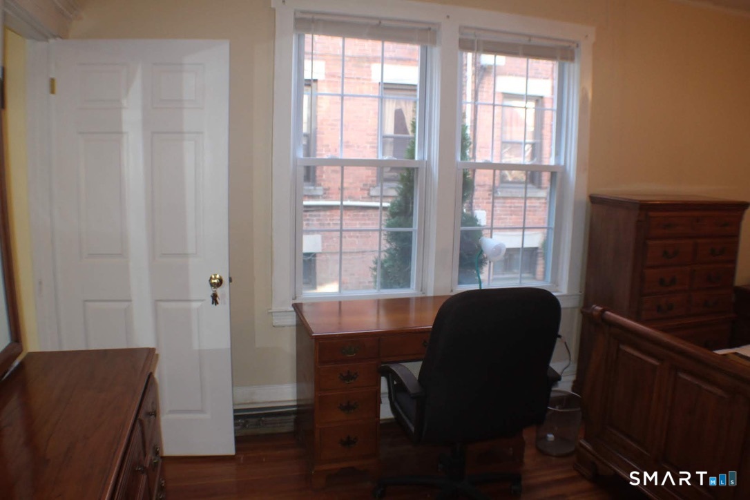 150 Whitney Street Hartford, CT 06105 - Photo 17 of 39 a view of a workspace with furniture and a window