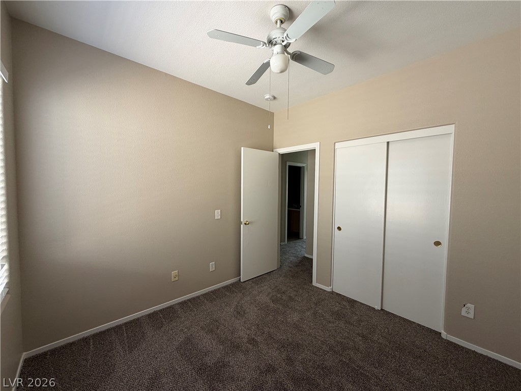 10975 Pumpkin Ridge Avenue Las Vegas, NV 89135 - Photo 10 of 13 An inviting bedroom features a vaulted ceiling and rich, textured carpeting.