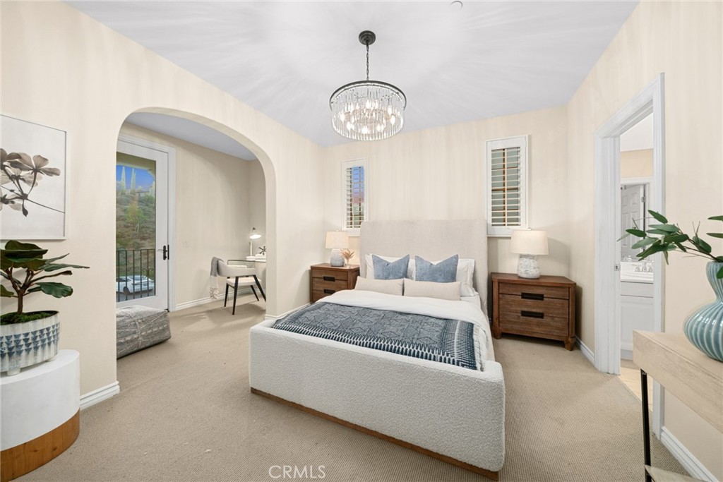 46 Silhouette Irvine, CA 92603 - Photo 36 of 42 a bedroom with a bed and a chandelier