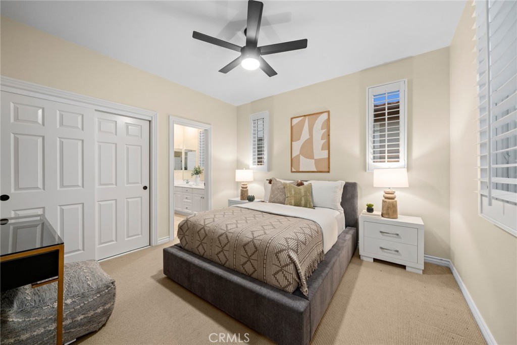 46 Silhouette Irvine, CA 92603 - Photo 39 of 42 a spacious bedroom with a bed a window and a couch