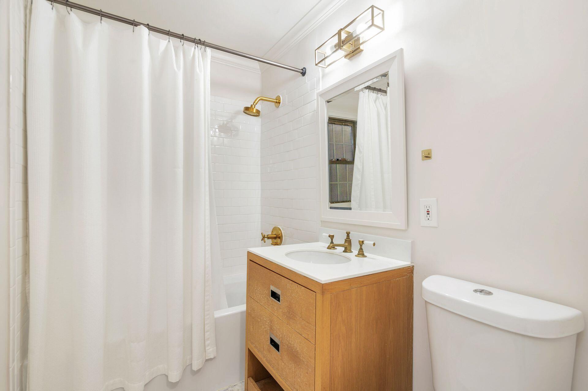 240 Almeria Road West Palm Beach, FL 33405 - Photo 15 of 24 a bathroom with a sink a toilet and shower