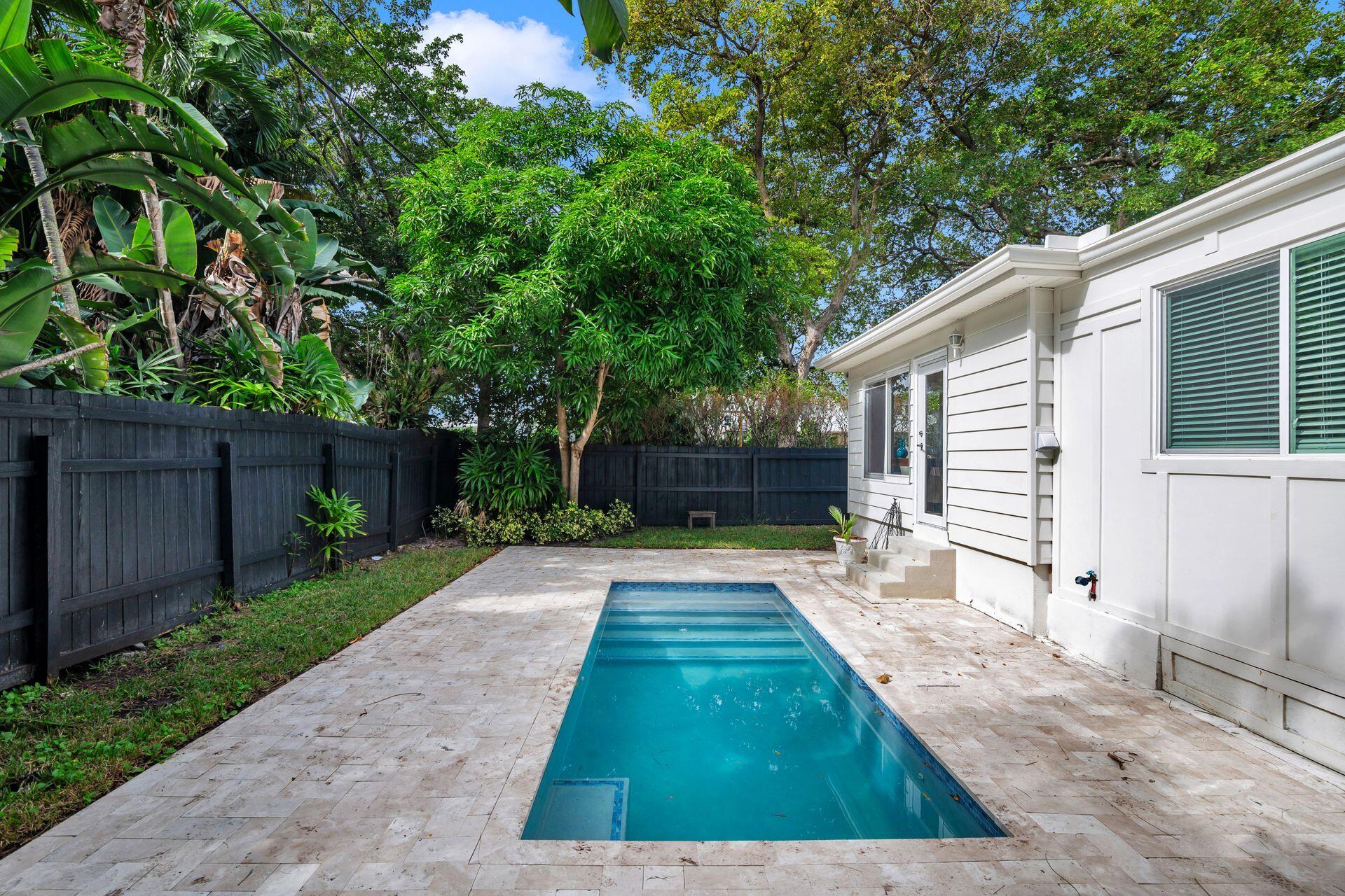 240 Almeria Road West Palm Beach, FL 33405 - Photo 19 of 24 a view of backyard with green space