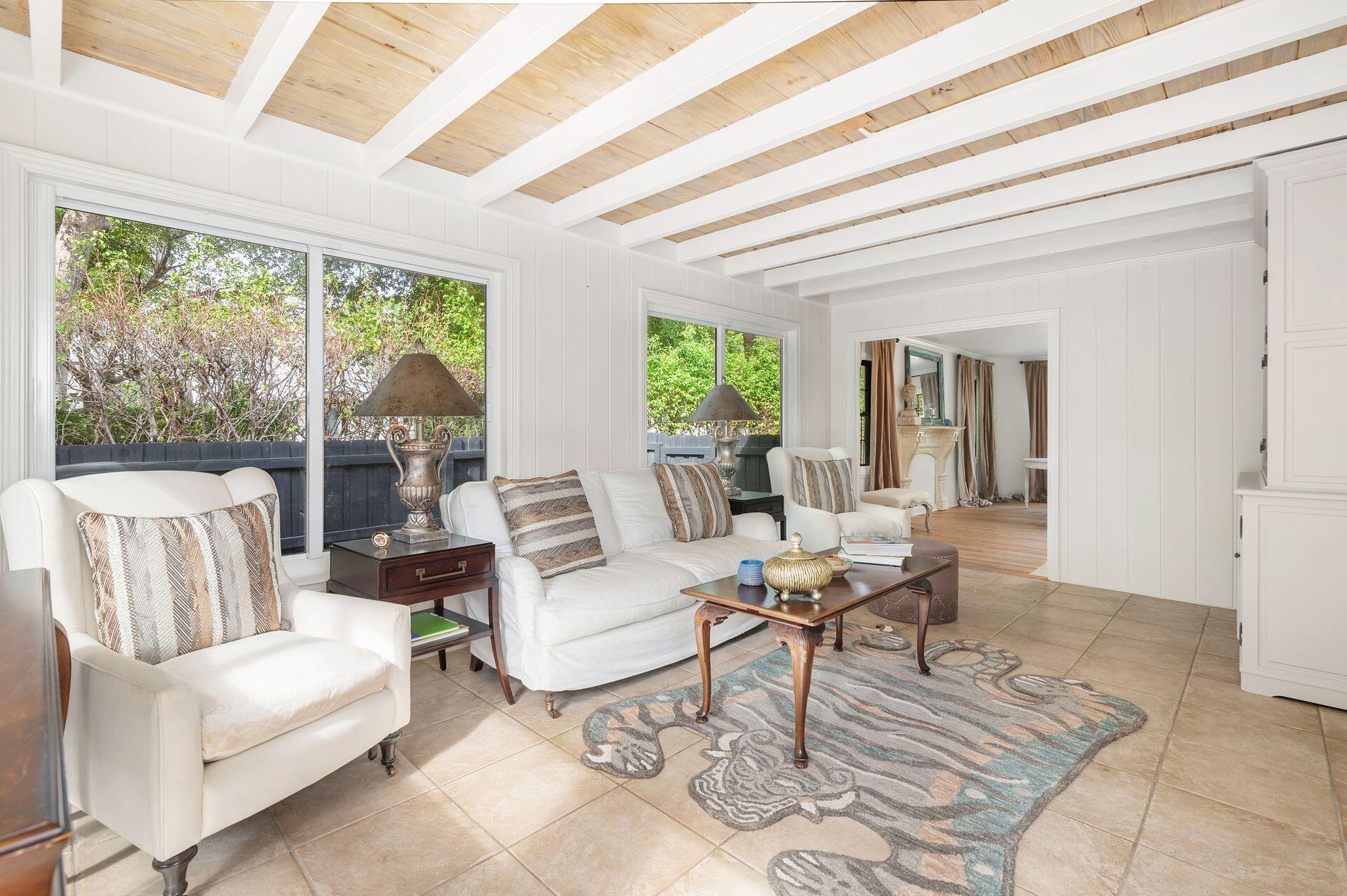 240 Almeria Road West Palm Beach, FL 33405 - Photo 6 of 24 a living room with furniture and a large window