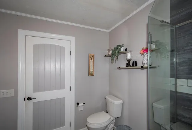 a bathroom with a toilet and a sink