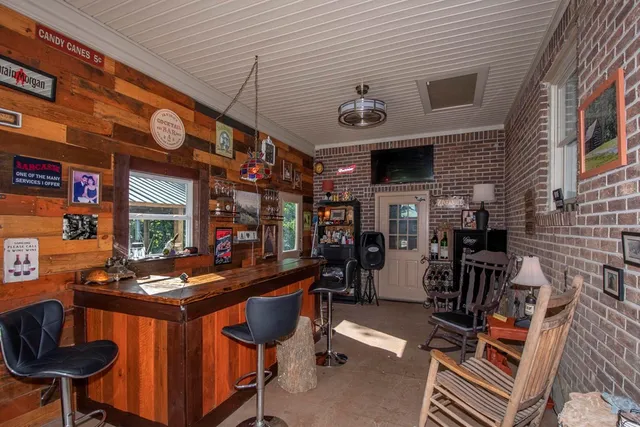 a view of a chairs and table in a patio