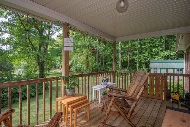 a view of a two chairs in the balcony