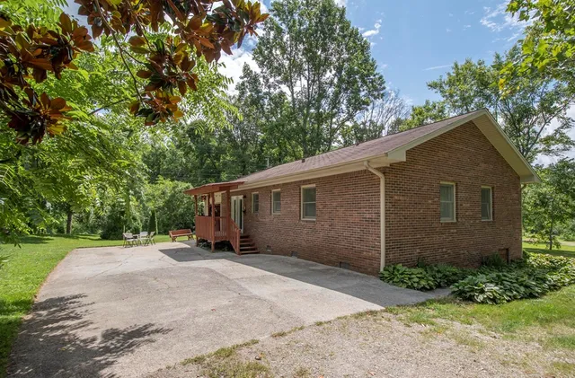 a backyard of a house with lots of green space