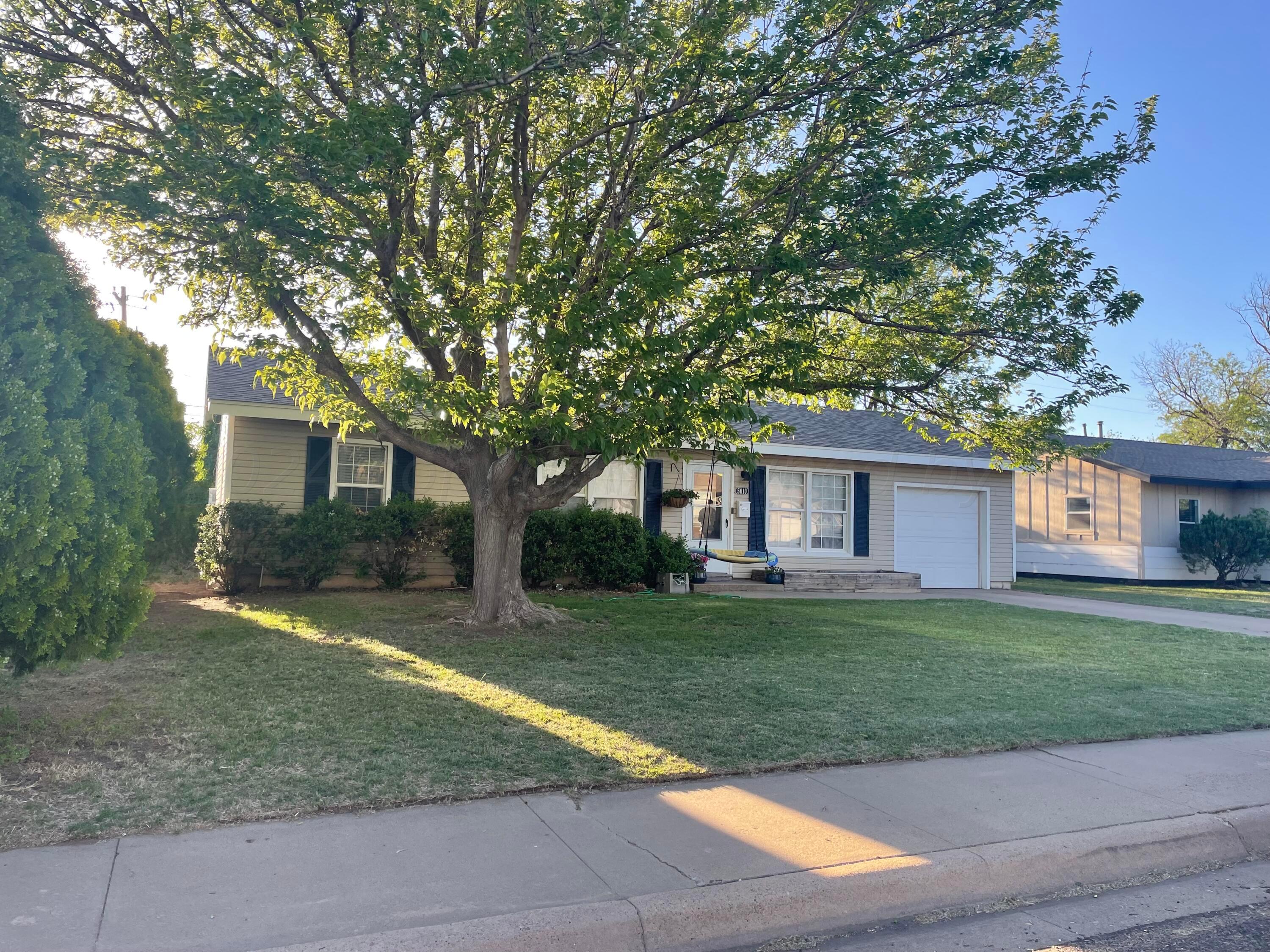 5010 South Fannin Street Amarillo, TX 79110 - Photo 1 of 10 a house that has a tree in front of a house