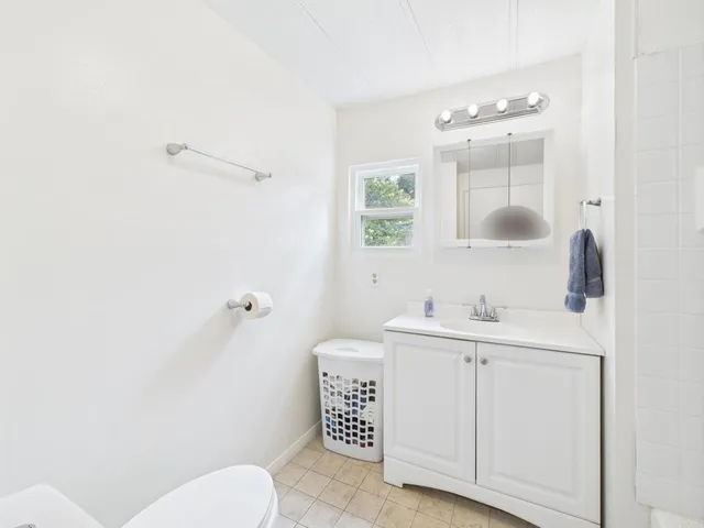 a bathroom with a bathtub and a sink