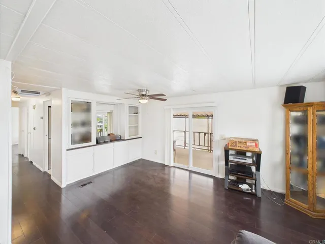 a view of a livingroom with wooden floor