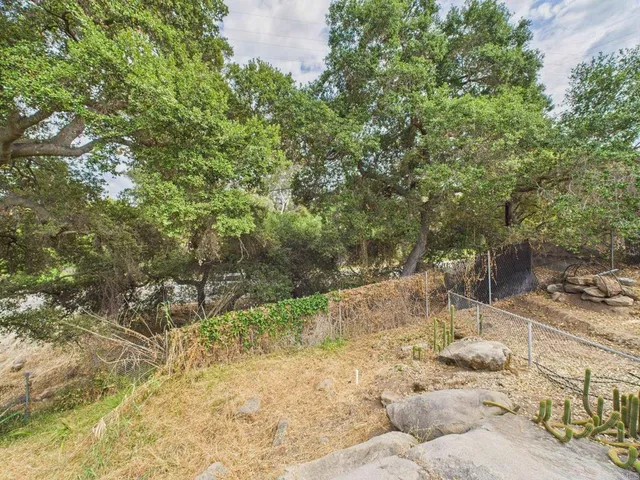 a backyard of a house with lots of green space