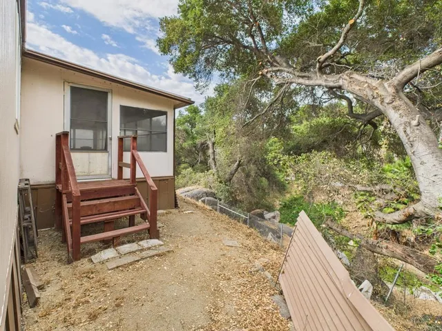 a backyard of a house with lots of green space