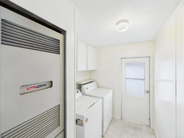 a car parked in front of white house