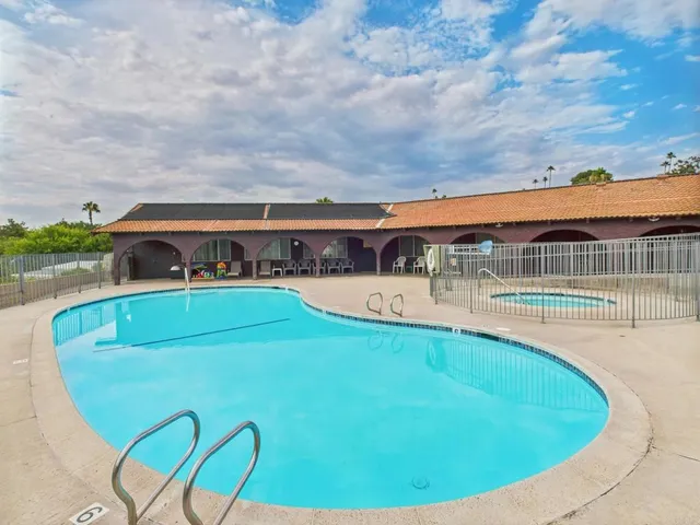 a view of a livingroom with furniture and a window