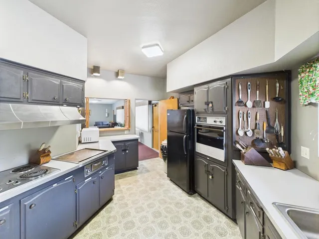 a room with pool table and windows