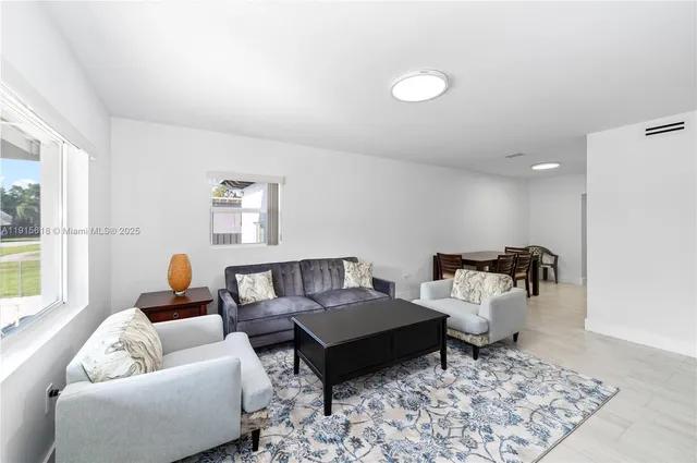 a living room with furniture and a window