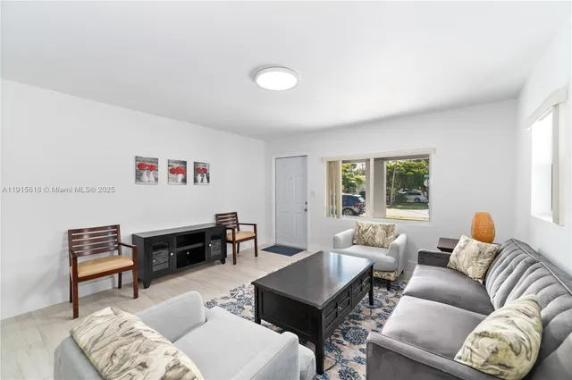 a living room with furniture and a window