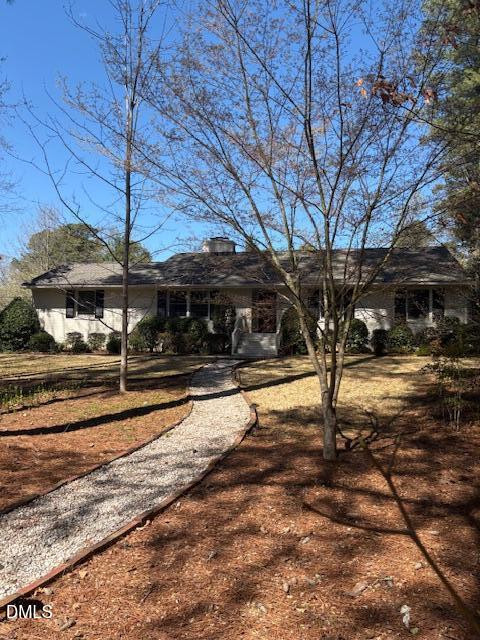 a view of a yard with wooden fence