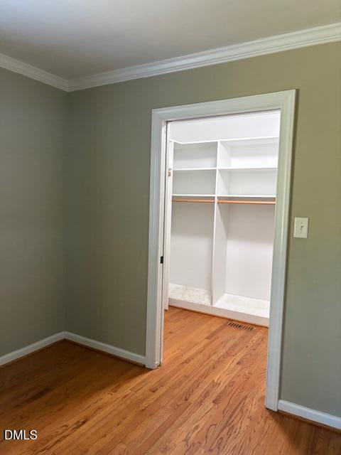 4408 Boxwood Road Raleigh, NC 27612 - Photo 7 of 7 a view of an empty room with wooden floor