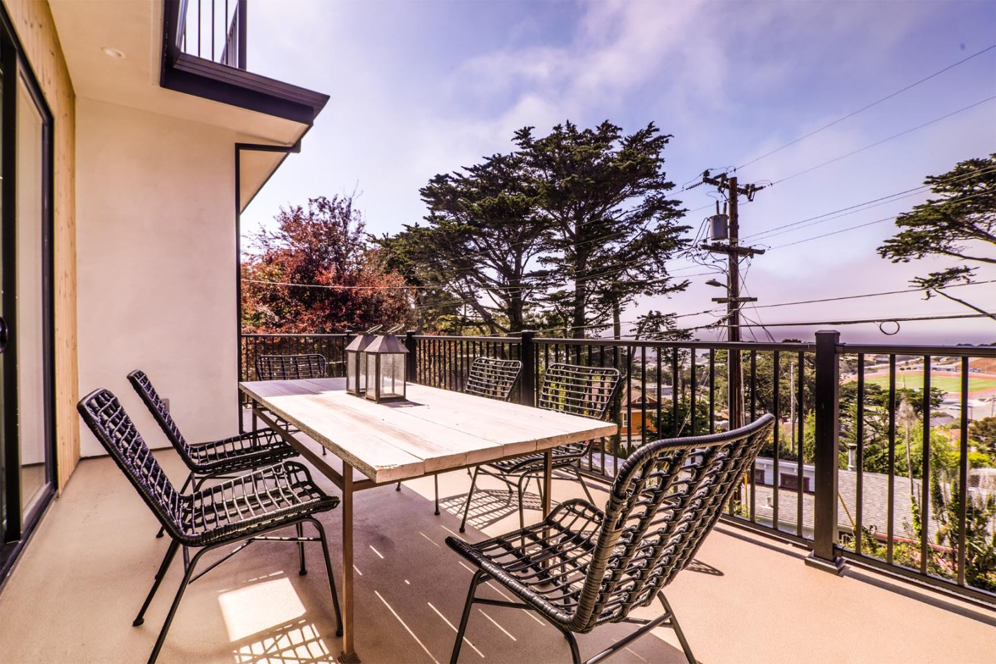 428 San Pablo Terrace Pacifica, CA 94044 - Photo 18 of 43 a view of a patio with a table and chairs