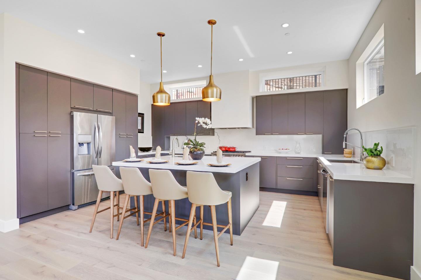428 San Pablo Terrace Pacifica, CA 94044 - Photo 9 of 43 a kitchen with stainless steel appliances kitchen island granite countertop a sink a stove a dining table and chairs