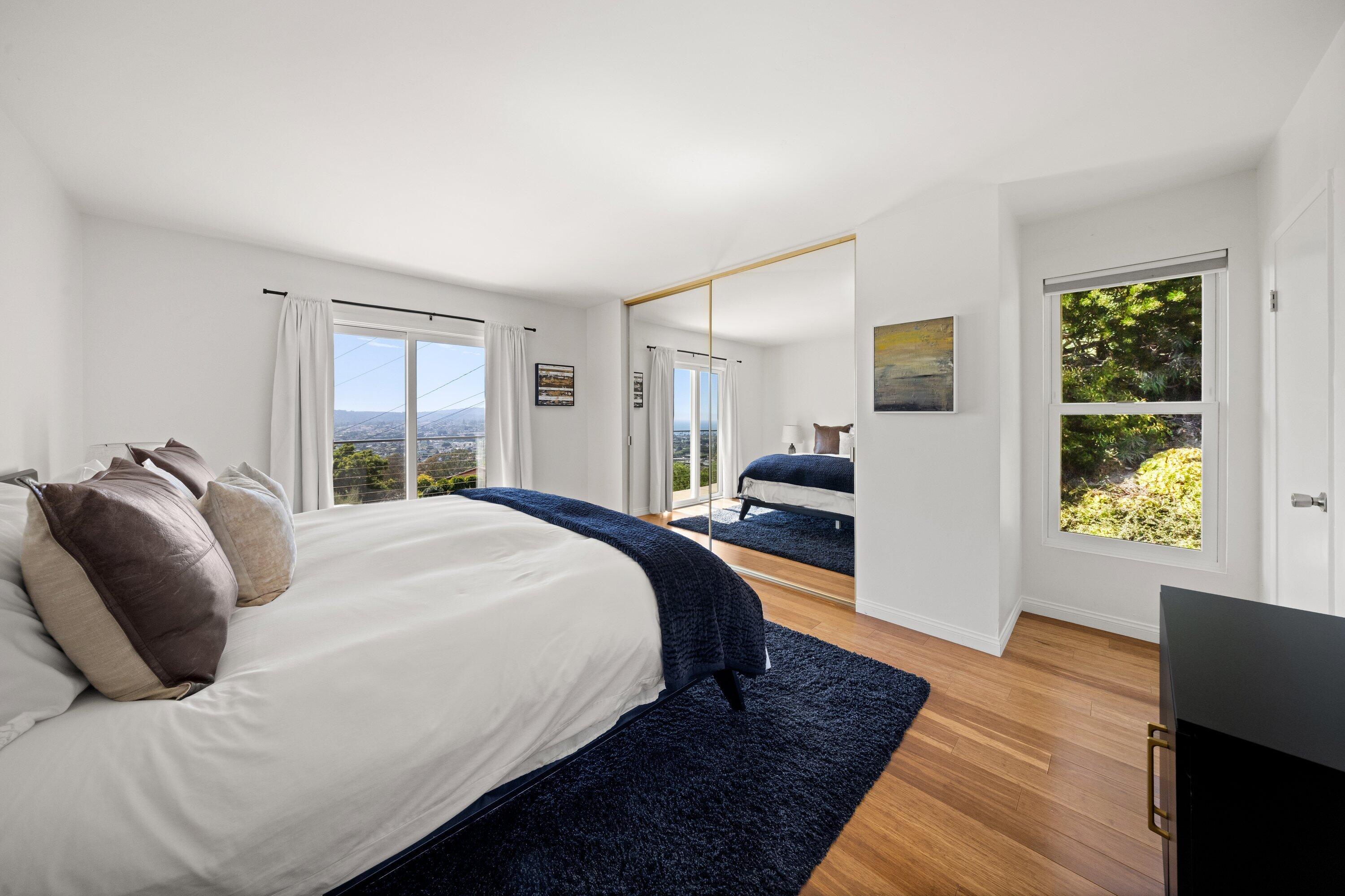 128 Las Alturas Road Santa Barbara, CA 93103 - Photo 14 of 34 a bed sitting in a bedroom next to a window